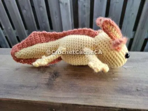 orange and yellow axolotl side view